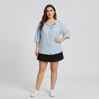 Camisa azul con lazo frontal y cuentas