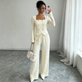 Two-piece set of elegant wide-leg trousers that accentuate the waist.